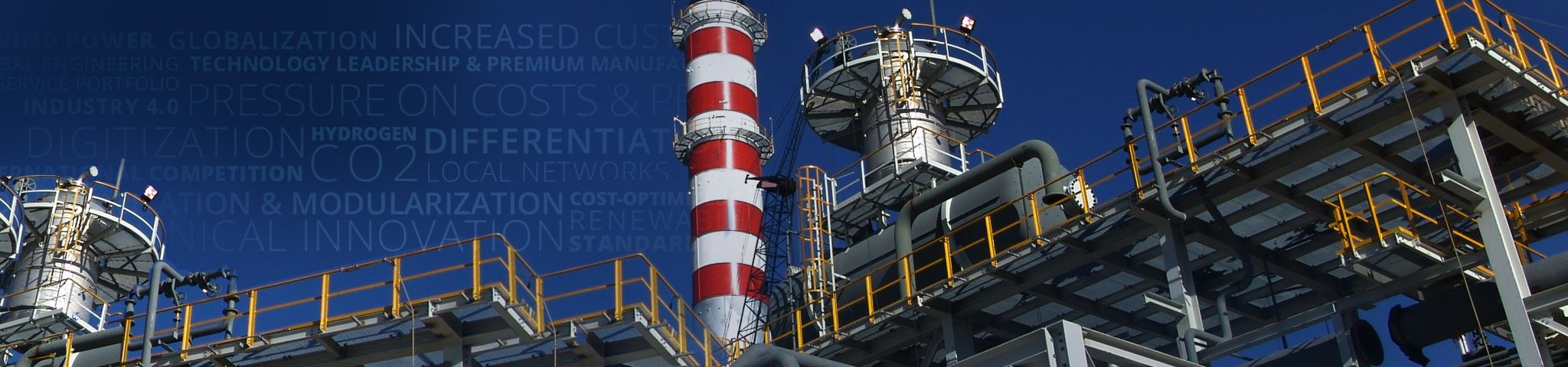 Fabrik für Maschinenbau und Energie mit rot-weiß gestreiften Turm.